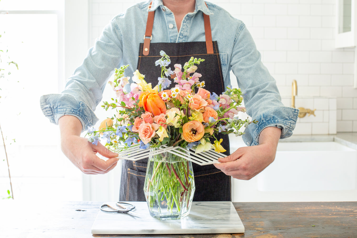 Local Clayton Florist Arranging Vase Of Fresh Flowers in Clayton, NC